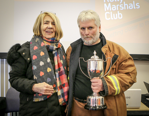 Dennis Bryan receives his award from Margaret Simpson