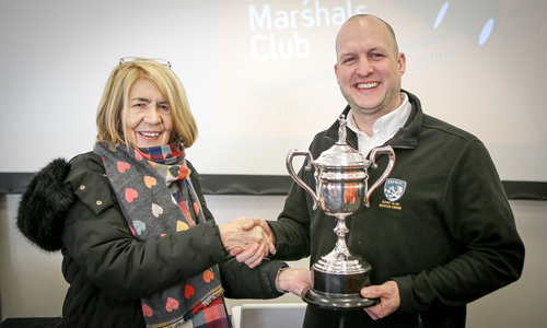 Ian Buckley receives his award from Margaret Simpson