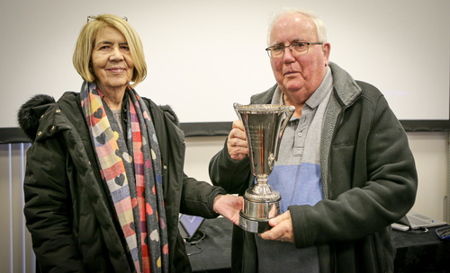 Mike Hodgson receives his award from Margaret Simpson